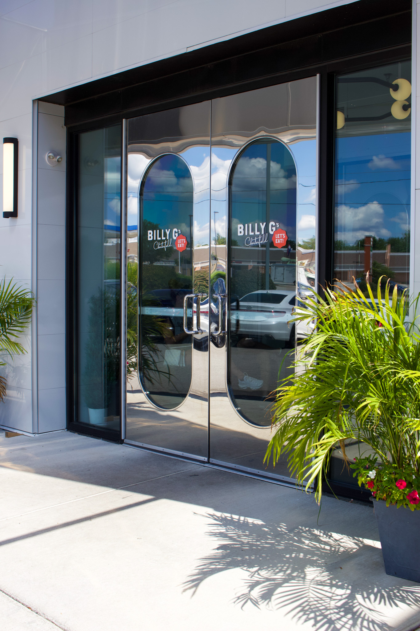 Chrome front doors and green plants